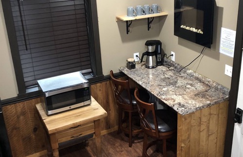 Weaverville House | Historic Carriage House Loft King Room with Full Kitchen