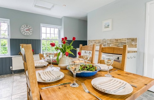 Bryngwran Cottage | The Manor - a hot tub that sleeps 8 guests in 3 bedrooms