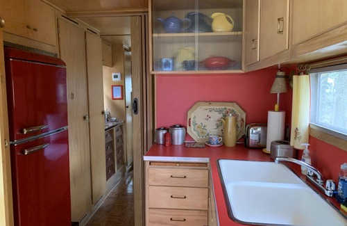 Sherman House | Experience The Mansion Vintage Trailer at Tin Can Acres