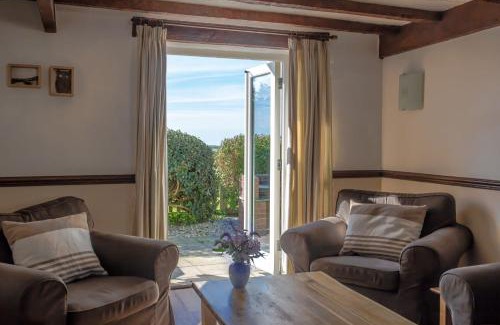 Hartland House | Cozy Oceanfront Retreat: The Milking Parlour Awaits You