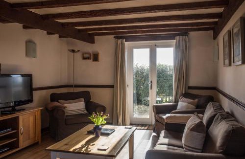 Hartland House | Cozy Oceanfront Retreat: The Milking Parlour Awaits You