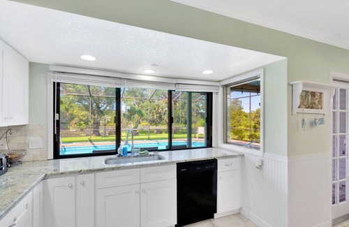 Lakeview Village House | Experience The Oak House: Waterfront Retreat with Heated Pool