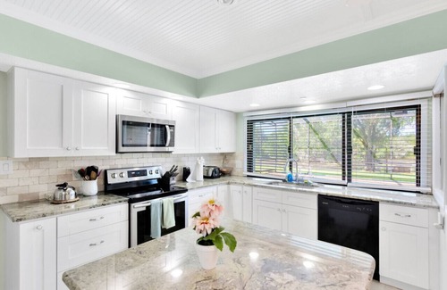 Lakeview Village House | Experience The Oak House: Waterfront Retreat with Heated Pool