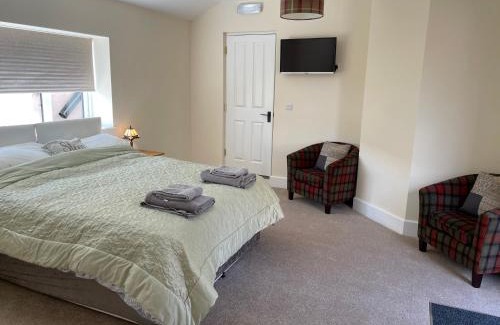 Burwarton Apartment | Charming Stay at The Old Kitchen with Hot Tub & Family Perks