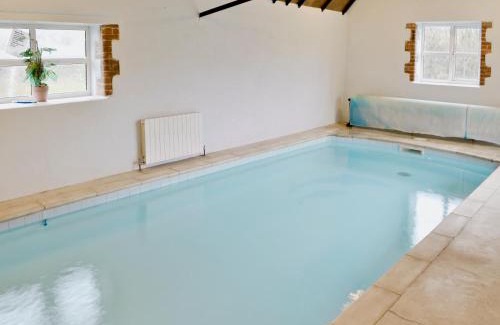 West Compton House | Discover The Old Piggeries: Family-Friendly Retreat with Pool