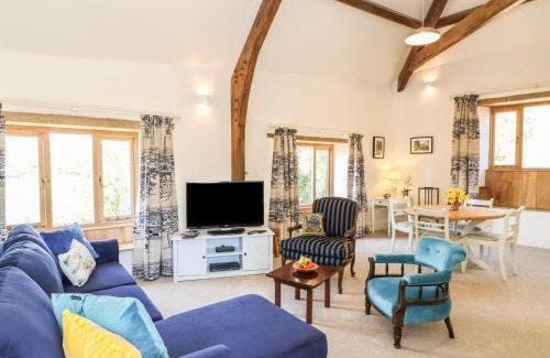 Luppitt House | Experience The Old Smithy: 4-Star Stay with Pool Access