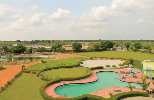 Bhilwara Apartment | Relax at The Palm Resort with Pool and Pet-Friendly Amenities