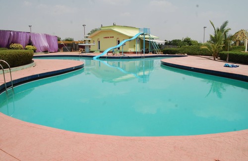 Bhilwara Apartment | Relax at The Palm Resort with Pool and Pet-Friendly Amenities