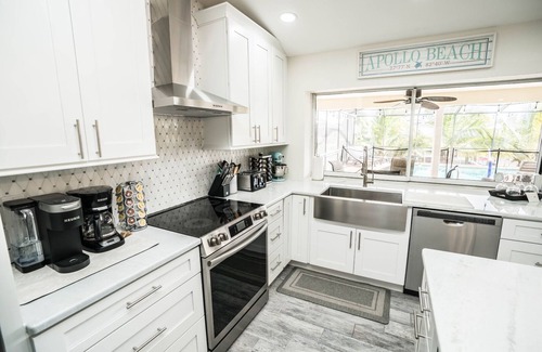 Apollo Beach House | Experience The Palm Tree Waterfront with Pool & Ocean Views