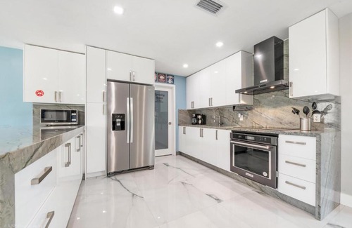 Cutler Bay House | Experience The Palms: Poolside Fun and Foosball Delight