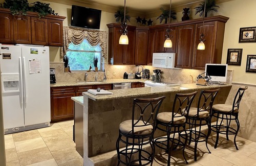Comanche Trail House | Experience The Palms: Waterfront Retreat with Spa & Hot Tub