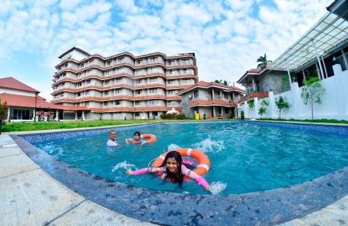 Kannur District Hotel | Discover The Pearl View Hotel: Poolside Relaxation Awaits