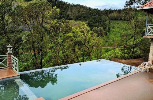 Suryanelli Resort | Discover The Planet Munnar: Family-Friendly Retreat with Pool