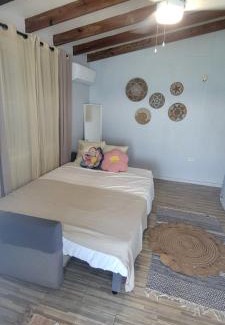 Pedernales House | Cozy Red Door Beach House with Oceanfront Views in Buye