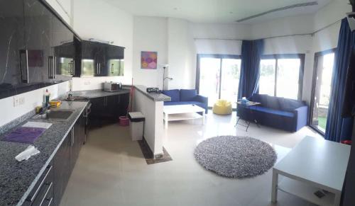 New Cairo Apartment | Explore The Resort Chalet - Porto New Cairo with Pool & Dining