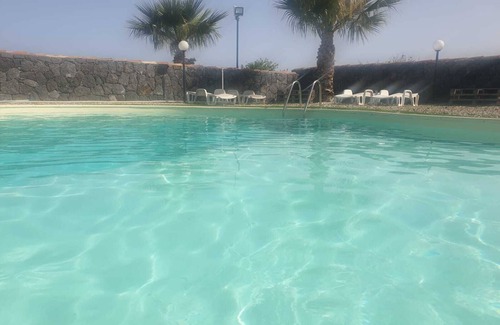 Santa Tecla Apartment | Rustic Events Venue with Pool and Oceanfront Views in Pozzillo