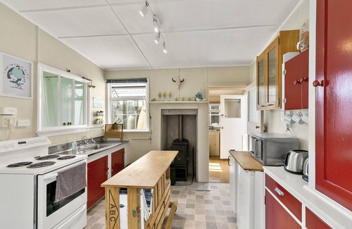 Foxton Beach Cottage | Discover The Smurf Shack: Retro Gem with Ocean Views