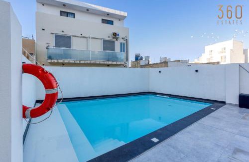 Swieqi Apartment | Relax at The Swieqi Poolside Suites with Family-Friendly Perks