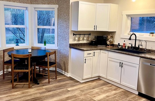 Ellsworth Cottage | Trimbelle Cottage: Riverside Retreat with Hot Tub & Fishing