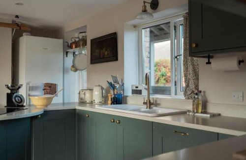 Totnes House | Discover The Walled Garden: Oceanfront Paradise Awaits