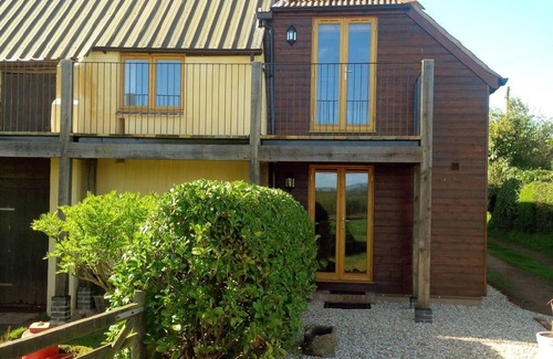 Brampford Speke Cottage | Discover The Woodshed: Family-Friendly & Pet Welcoming Stay