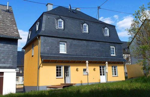 Irmenach House | Bright Yellow Vacation Home with Spa & Breakfast Included