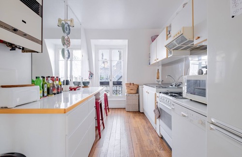 Grenelle Apartment | Experience Theatre in the Sky with Spa and Family Amenities