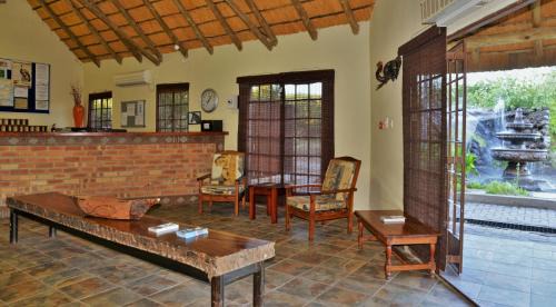 Kasane Hotel | Experience Thebe River Safaris with Pool and Dining Options