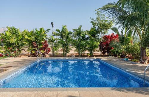 Bhongir Villa | TheSunlitHaven Pool GlassRooms Lawn
