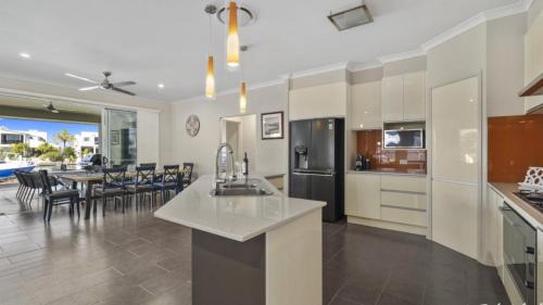 Banksia Beach House | Indulge in Elegance with Pet-Friendly Comfort & Pool Access