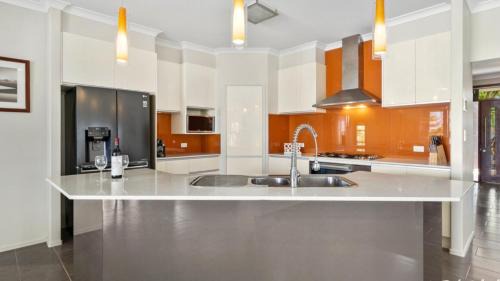 Banksia Beach House | Indulge in Elegance with Pet-Friendly Comfort & Pool Access
