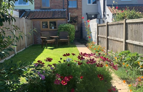 Sheringham Cottage | Charming Cottage Steps from Beeston Common and Beach
