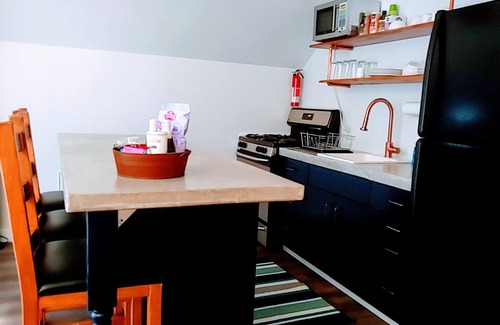Hurricane Apartment | Top Floor Retreat: 10/10 Rated with Spa & Hot Tub