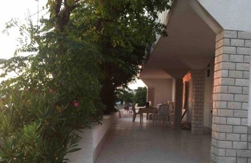Kustici Apartment | Oceanfront Three-Bedroom Apartment Steps from Kustići Beach