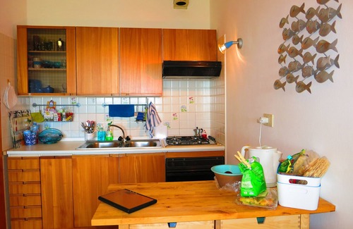 San Teodoro Apartment | Inviting Three-Room Apartment with Sea View and Garden