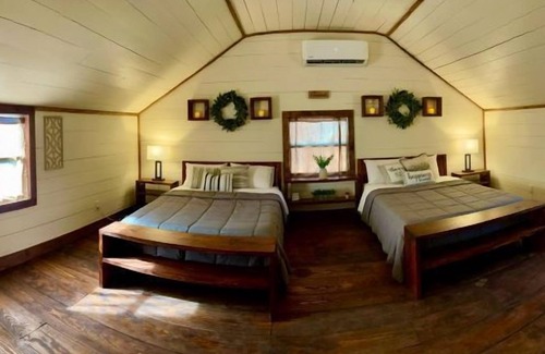 Denison Hotel | Relaxing Tiny Home Vacations Resort with Pool & Spa