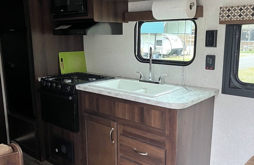 Aurora RV Rental | Cozy Tiny House on Wheels with Kitchen & Breakfast Included