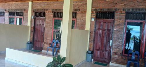 Tuk Tuk House | Budget-Friendly Toba Boi: Pet & Child Friendly Haven