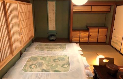 Obu Apartment | Experience Tomo's INN: A 9/10 Guest Favorite Escape