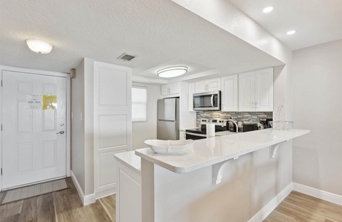 Cocoa Beach Condo | Top Floor Oceanfront Condo w/ Pool, Private Balcony, & Bright Coastal Design!