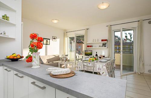Torbole sul Garda Apartment | Relax in Torbole: Pool & Balcony Apartment Retreat