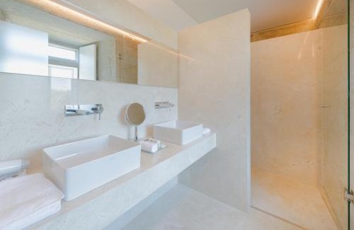 Tomino Hotel | Discover Torre de Tebra: Oceanfront Escape with Pool