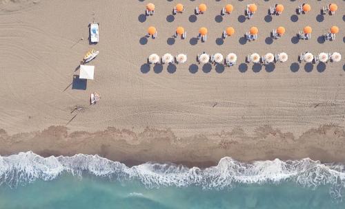 Tarquinia Hotel | Relax at Torre Del Sole with Ocean Views and Pool Access