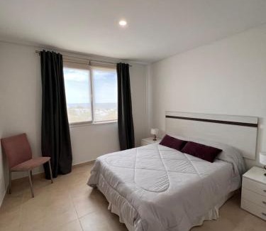 Las Grutas Apartment | Relax at Torre Las Grutas: Oceanfront Getaway with Pool