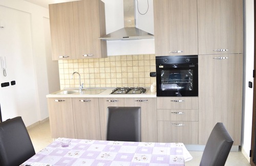 Mazara del Vallo Apartment | Relax at Tortuga3: Nighttime Pool and Oceanfront Views