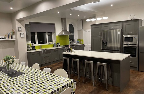 Mundesley House | Tower House: Award-Winning Family Haven by Sandy Beach