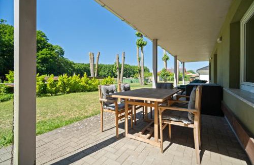 Muritz House | Cozy Retreat with Fireplace and Expansive Garden Space