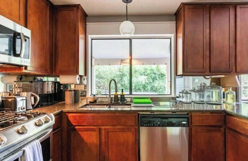 Los Indios House | Tranquil Family Retreat in NW Austin, Hot Tub, Office, & Backyard Escape