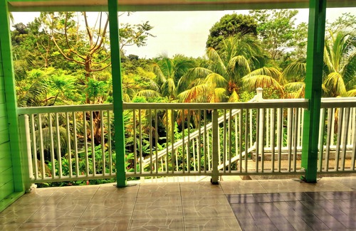 Pointe Michel Cabin | Cozy Tranquility Suite with Ocean View and Pool Access