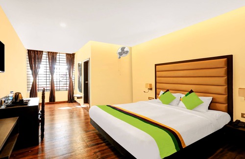 Stuart Hill House | Budget-Friendly Treebo Doha King with Family Amenities